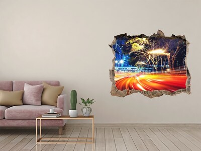 Wandfolien Loch in der Wand Eine Stadt in Bewegung bei Nacht