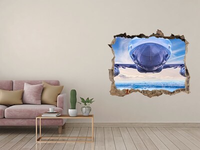 Wandtattoos Mauerdurchbruch Ein Flugzeug über der Stadt