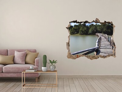 Wandfolien Loch in der Wand Eine Brücke über das Wasser