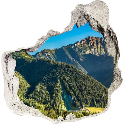 Wandaufkleber Loch 3D Berglandschaft mit einem Tal