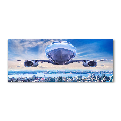 Bild auf Acrylglas Ein Flugzeug über der Stadt