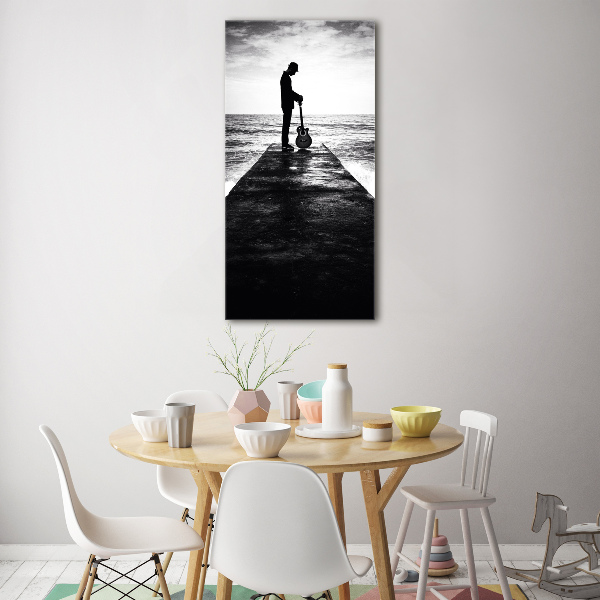 Plexiglasbilder vertikal Gitarrist auf dem Pier