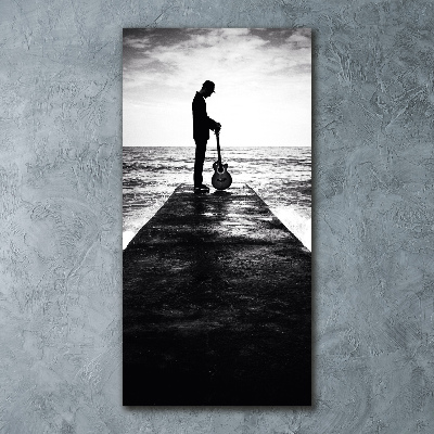 Plexiglasbilder vertikal Gitarrist auf dem Pier