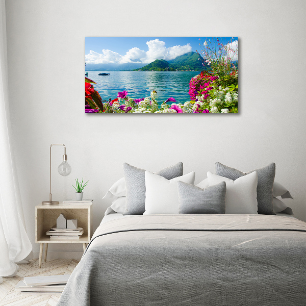 Bild auf leinwand Blumen am See