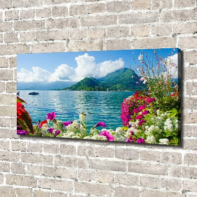 Bild auf leinwand Blumen am See
