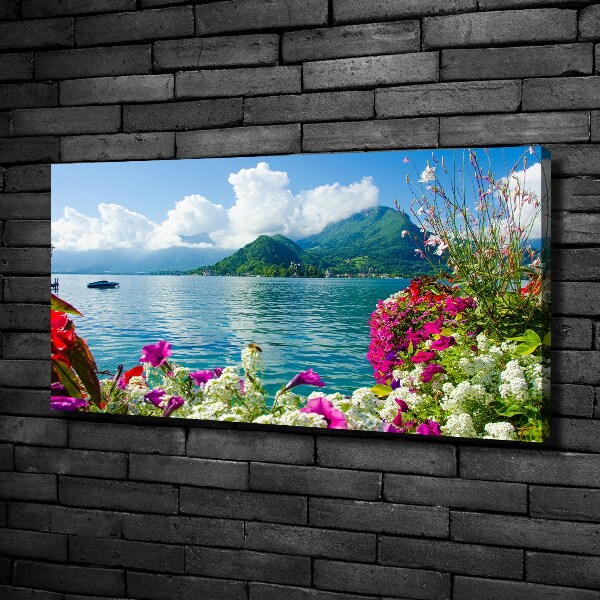 Bild auf leinwand Blumen am See