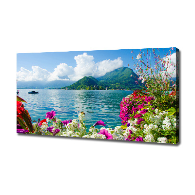 Bild auf leinwand Blumen am See