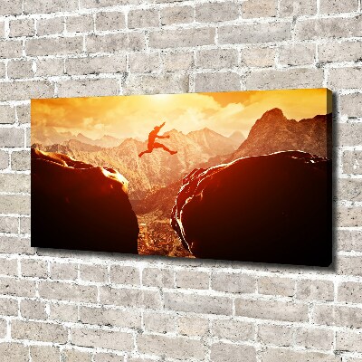 Wandbild Spring über den Abgrund