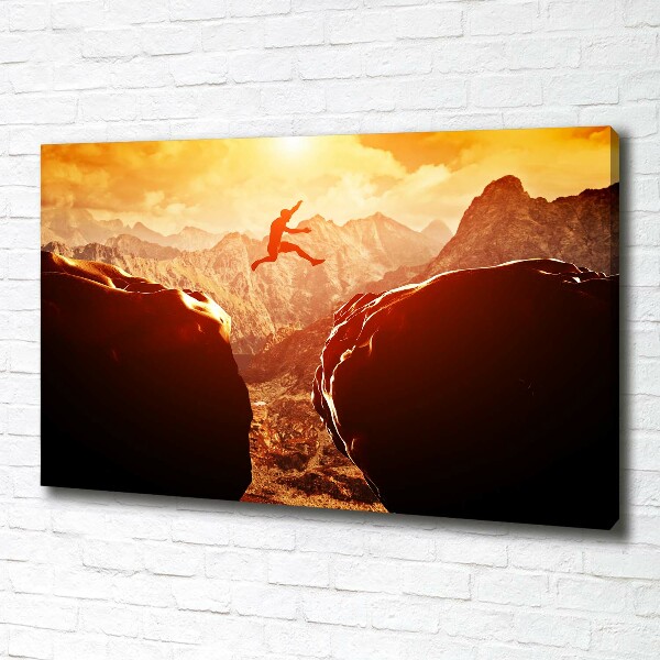 Wandbild Spring über den Abgrund