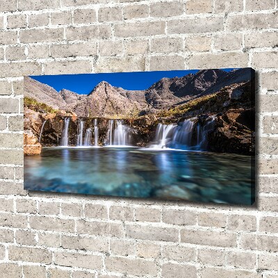 Bild auf leinwand Wasserfall in den Bergen