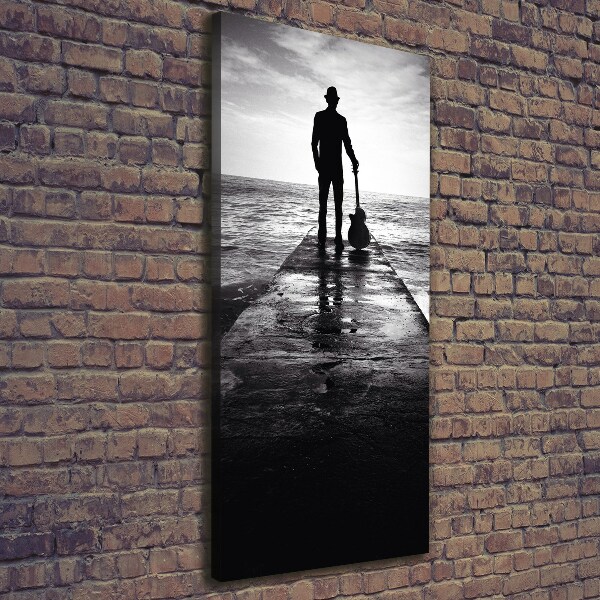 Foto auf leinwand vertikales Gitarrist auf dem Pier