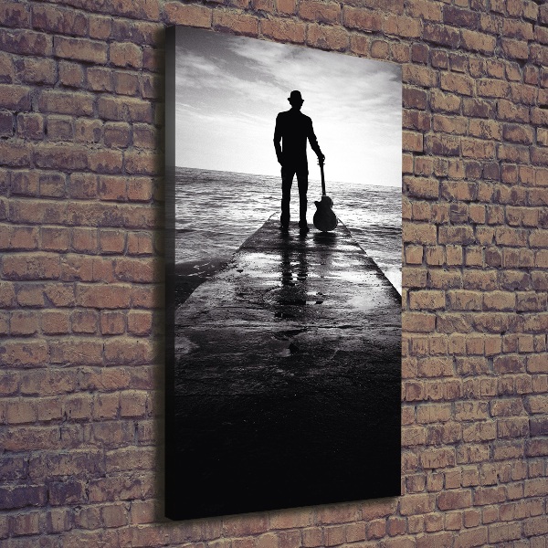 Foto auf leinwand vertikales Gitarrist auf dem Pier