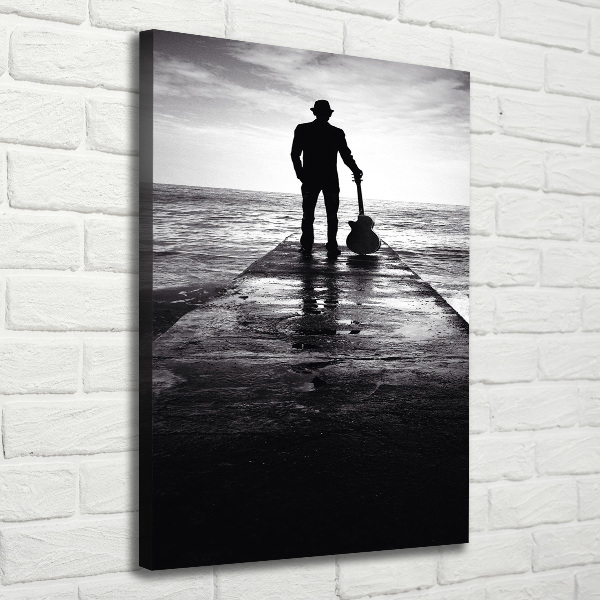 Foto auf leinwand vertikales Gitarrist auf dem Pier