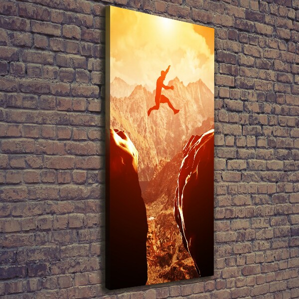 Foto leinwand vertikales Spring über den Abgrund