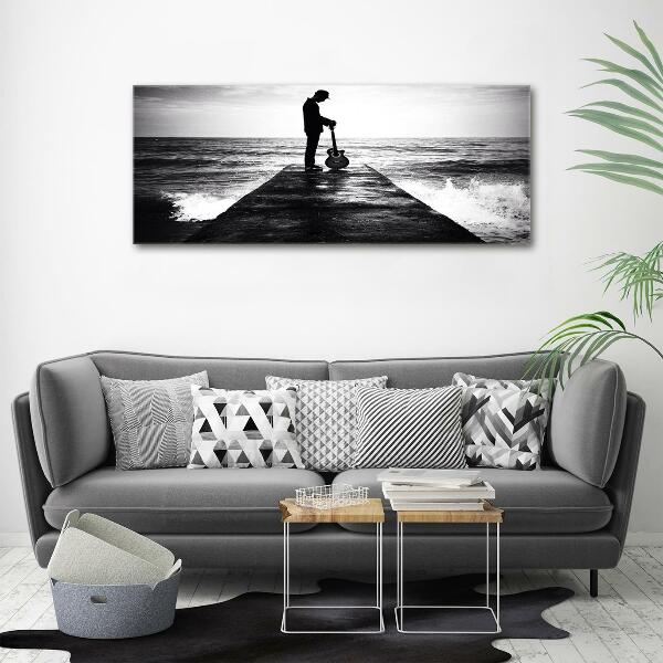 Glasbild Gitarrist auf dem Pier