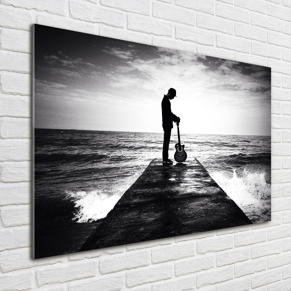 Glasbild Gitarrist auf dem Pier