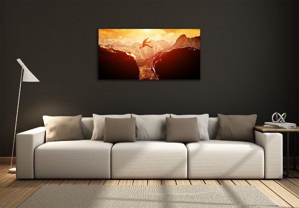 Glasbild Spring über den Abgrund