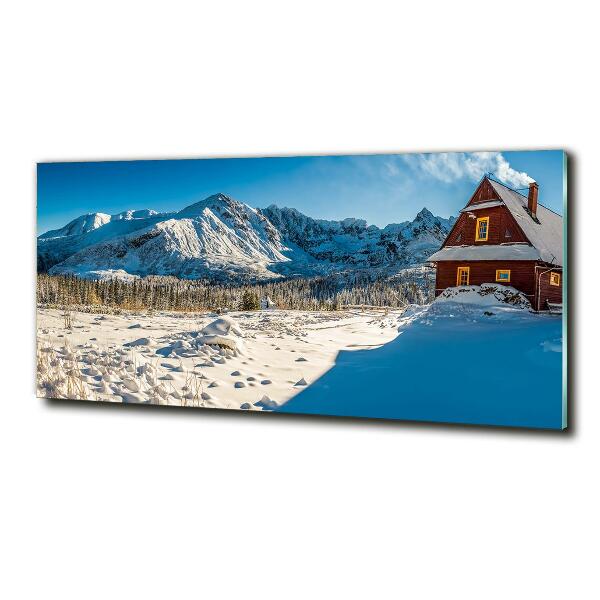 Glasbild Ein Ferienhaus in den Bergen