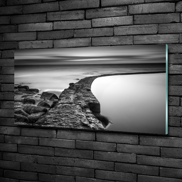 Glasbild Felsiger Strand