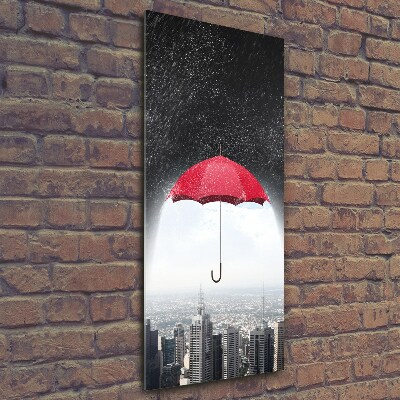 Glasbild vertikales Regenschirm über der Stadt