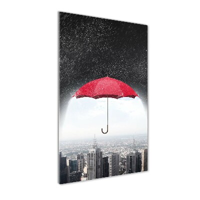 Glasbild vertikales Regenschirm über der Stadt