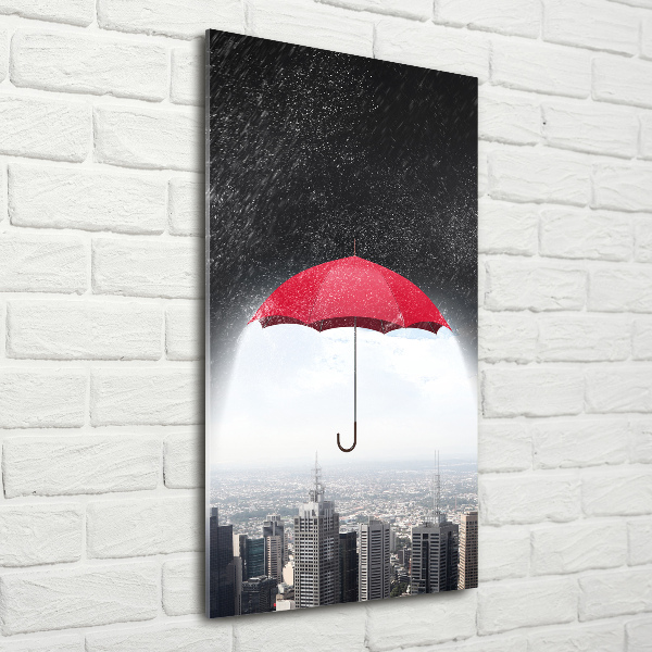 Glasbild vertikales Regenschirm über der Stadt