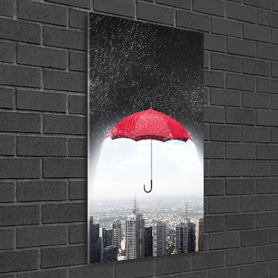 Glasbild vertikales Regenschirm über der Stadt