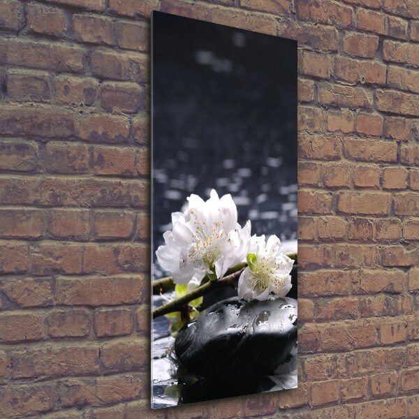 Glasbild vertikales Blumen und Steine