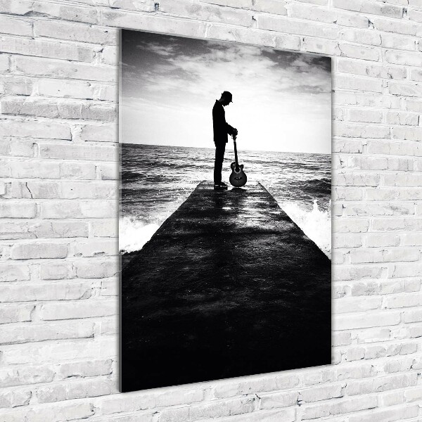 Foto auf glas vertikales Gitarrist auf dem Pier