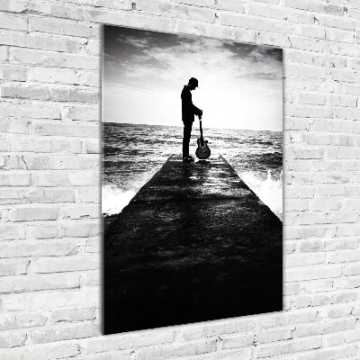 Foto auf glas vertikales Gitarrist auf dem Pier