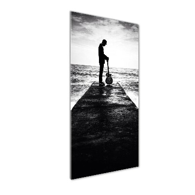 Foto auf glas vertikales Gitarrist auf dem Pier