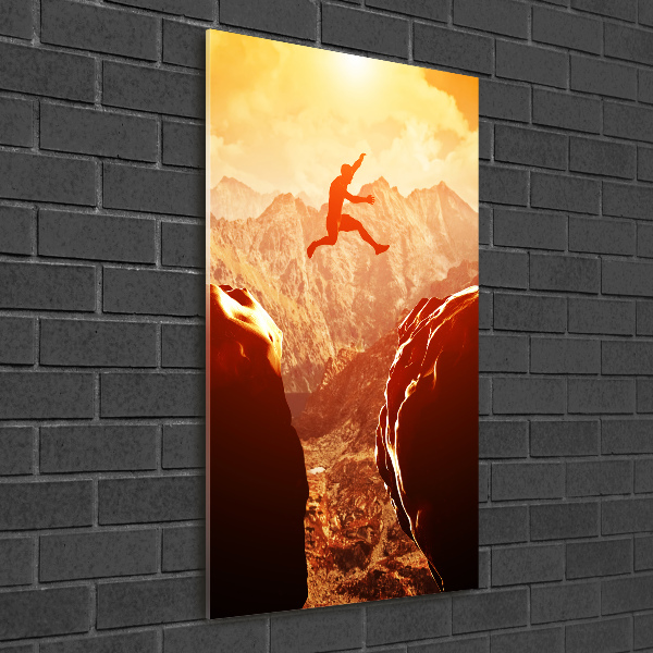 Foto auf glas vertikales Spring über den Abgrund