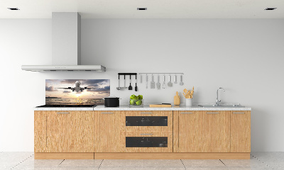 Platte für Küchenrückwand Ein Flugzeug über dem Meer