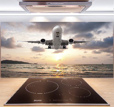 Platte für Küchenrückwand Ein Flugzeug über dem Meer