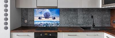 Küchen wandpaneel Ein Flugzeug über der Stadt