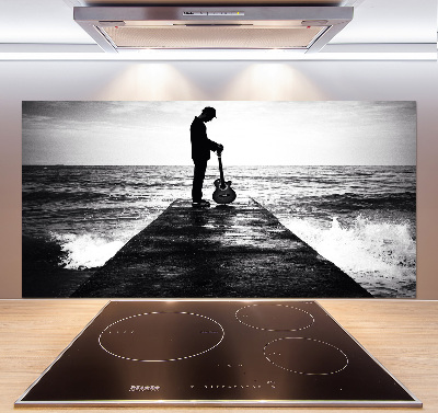 Glasrückwand für die küche Gitarrist auf dem Pier