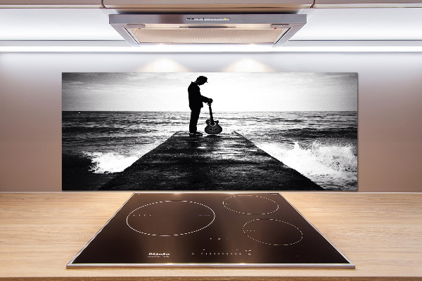 Glasrückwand für die küche Gitarrist auf dem Pier