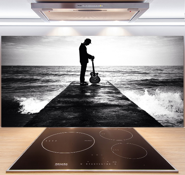 Glasrückwand für die küche Gitarrist auf dem Pier