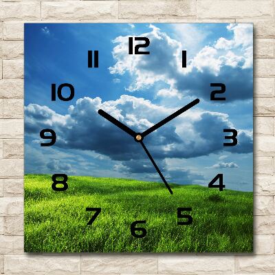 Wanduhr quadratisch Wolken über dem Feld