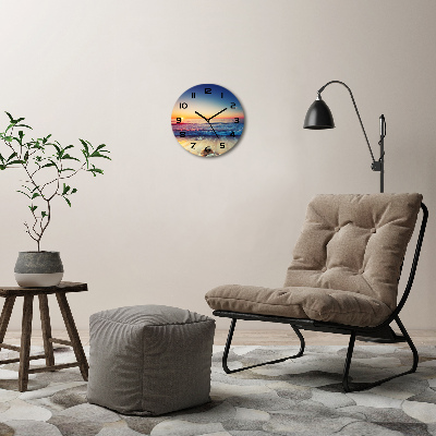 Wanduhr rund Sonnenaufgang am Meer