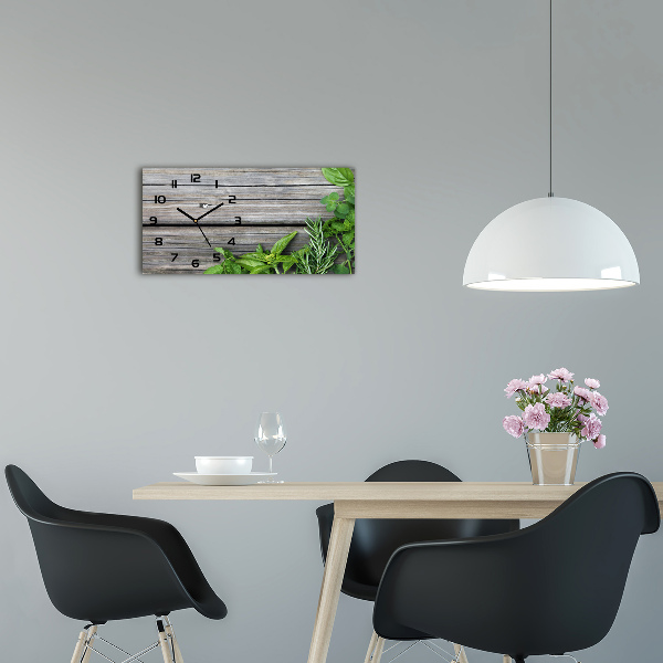 Glasuhr Hintergrund aus Holz mit Kräutern