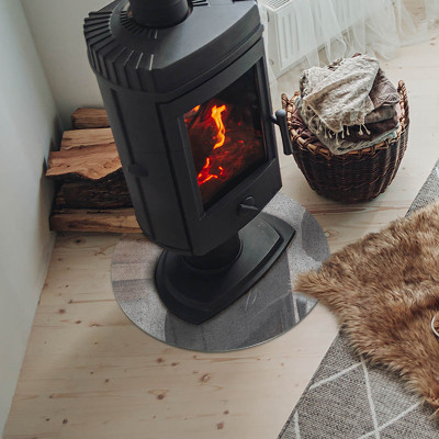 Runde Glasplatte für Kaminofen Betonstruktur im Rohstil