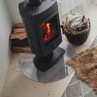 Runde Glasbodenplatte Kamin Rohbetonstruktur