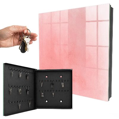 Schlüsselbox für die Wand mit rosa Hintergrund