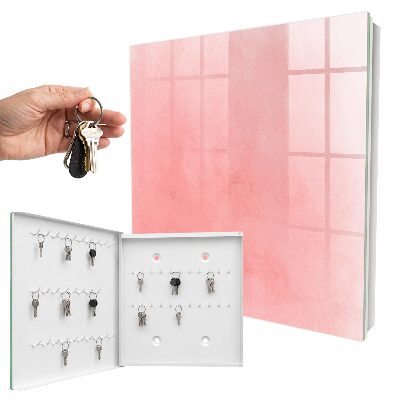 Schlüsselbox für die Wand mit rosa Hintergrund