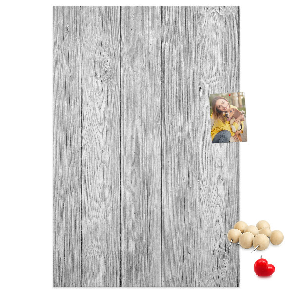Bedruckte Korkplatte mit Textur von grauen Holzbrettern als Hintergrund