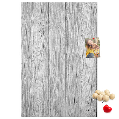 Bedruckte Korkplatte mit Textur von grauen Holzbrettern als Hintergrund