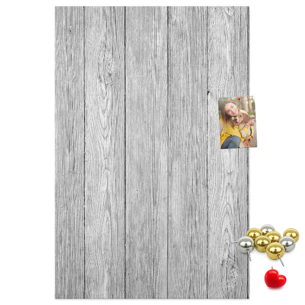 Bedruckte Korkplatte mit Textur von grauen Holzbrettern als Hintergrund