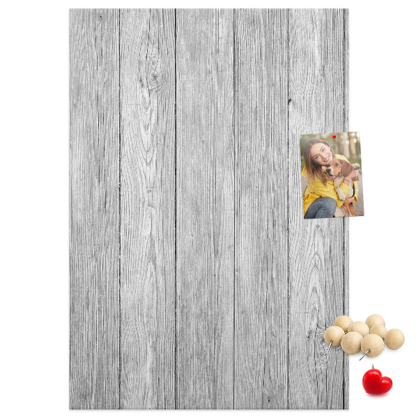Bedruckte Korkplatte mit Textur von grauen Holzbrettern als Hintergrund