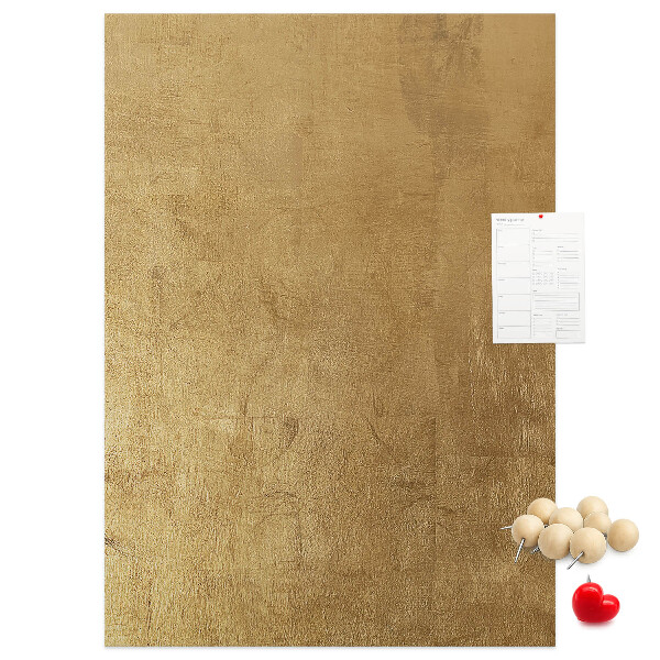 Kork-Pinnwand mit Goldpapier und farbigen Stecknadeln